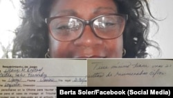 Berta Soler, líder de las Damas de Blanco, muestra el documento entregado por funcionaria de la Oficina de Multas.