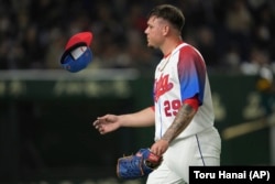 El pitcher Yariel Rodríguez en el juego contra Australia, en los cuartos de final del Clásico Mundial de Báisbol, en Tokío, Japón, en marzo de 2023. (AP/Toru Hanai)