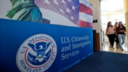 FILE - In this Aug. 17, 2018, people arrive before the start of a naturalization ceremony at the USCIS Miami Field Office in Miami. AP