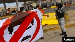 Una protesta contra los resultados de las elecciones en Venezuela que dan como ganador a Nicolás Maduro, en Ciudad Juárez, México. (REUTERS/Jose Luis González)